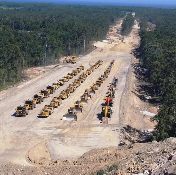 A fleet of earth moving machines used on the upgrade