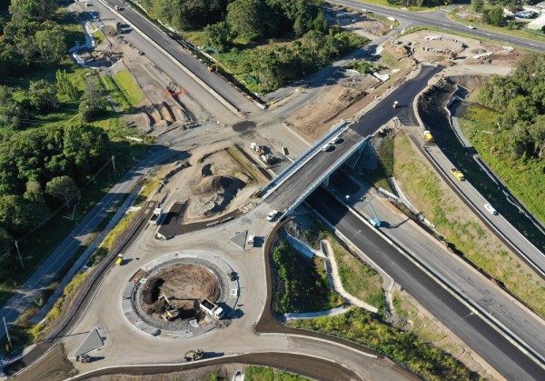 Aerial view of round a bout under construction with bridge over highway