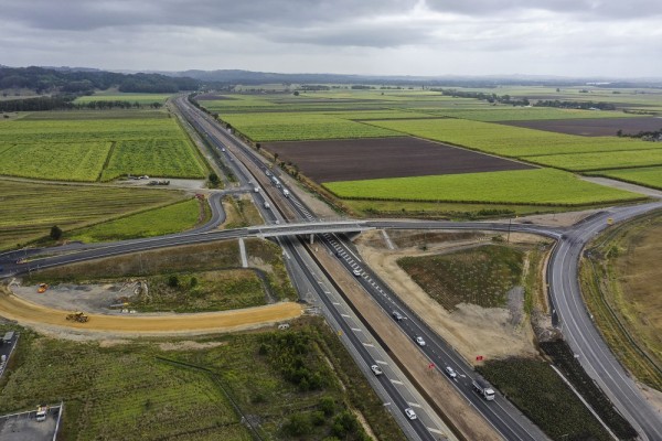 Aerial view of bridge over road and paddocks in background 